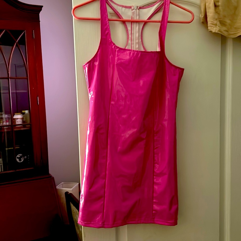 never been worn. It’s really cute, pleather bright pink/red